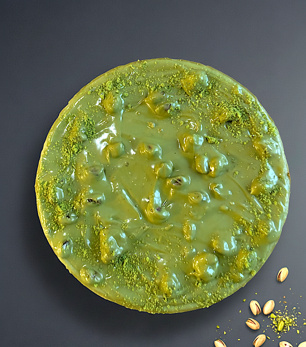 Pistachio cheesecake with crushed nuts on top